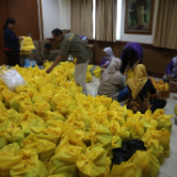 /media/orig/volunteers-help-preparing-the-food-packages-dan-hygiene-kits.JPG