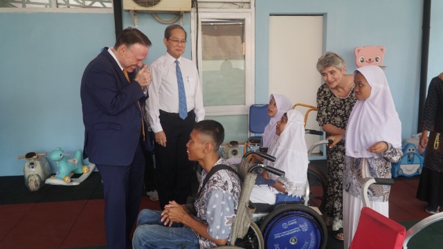 Church Representative greeting YPAC Students.JPG